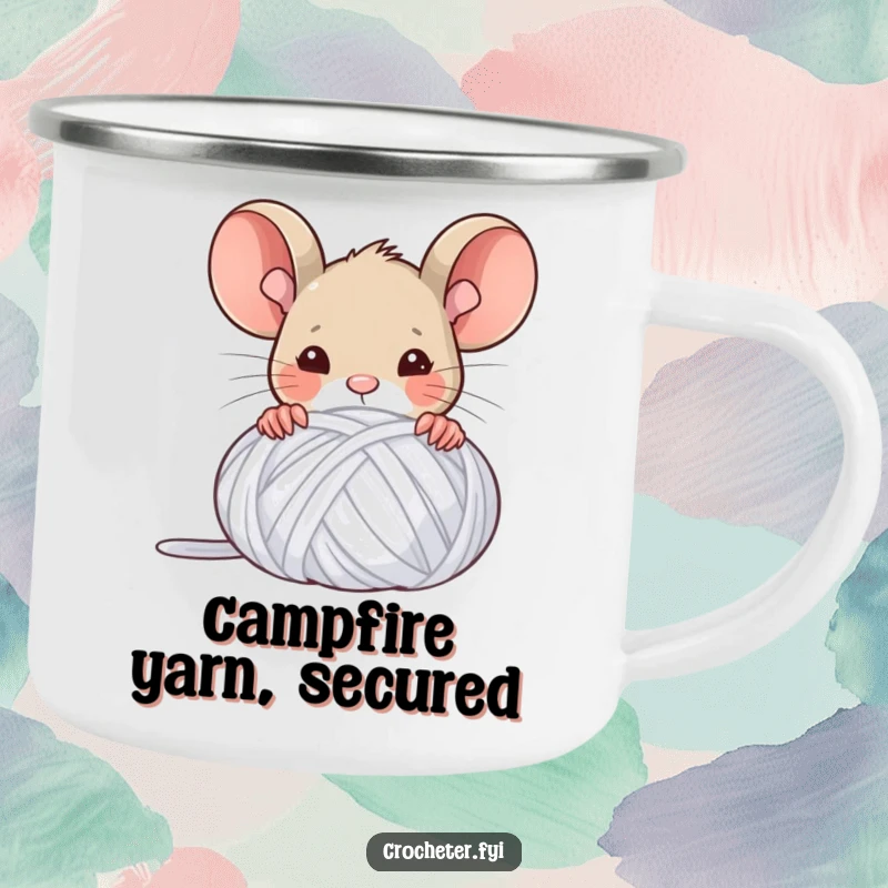 Funny camping mug featuring a triumphant mouse peeking from behind a yarn ball, celebrating crafting achievements outdoors.