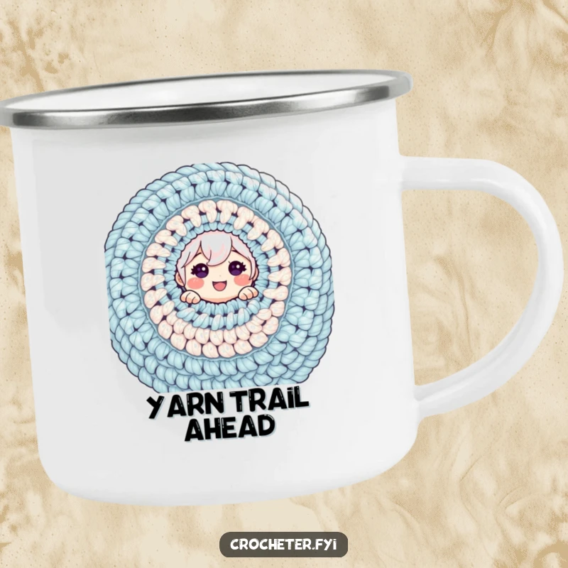 Funny camping mug with a cheerful character peeking from a massive crochet project, great for outdoor enthusiasts.