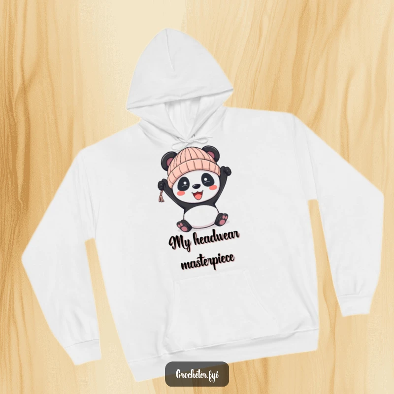 Funny panda hoodie, depicting a proud panda holding a slightly crooked knitted hat, symbolizing handmade effort.