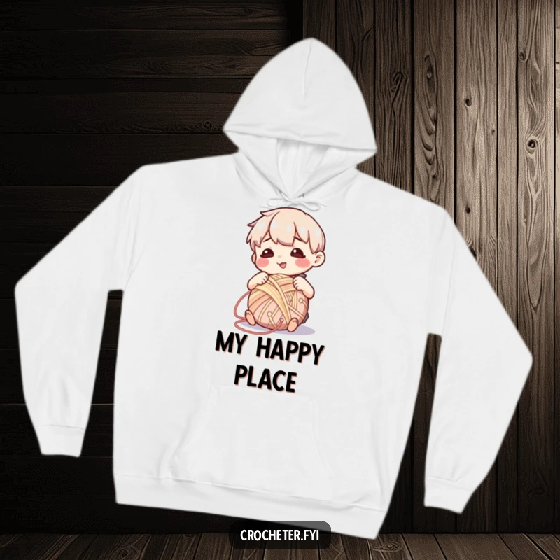 Funny hoodie showcasing a character with a serene expression, happily winding yarn into a perfect ball, a symbol of peaceful crafting.