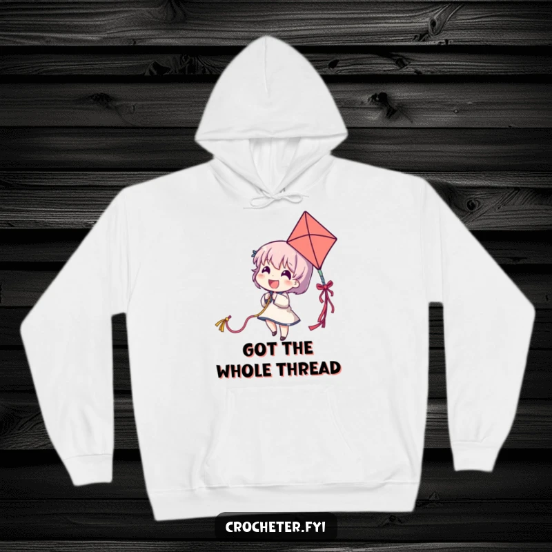 Funny hoodie featuring a delighted character pulling a long, colorful yarn strand as a kite, perfect for cozy fun.