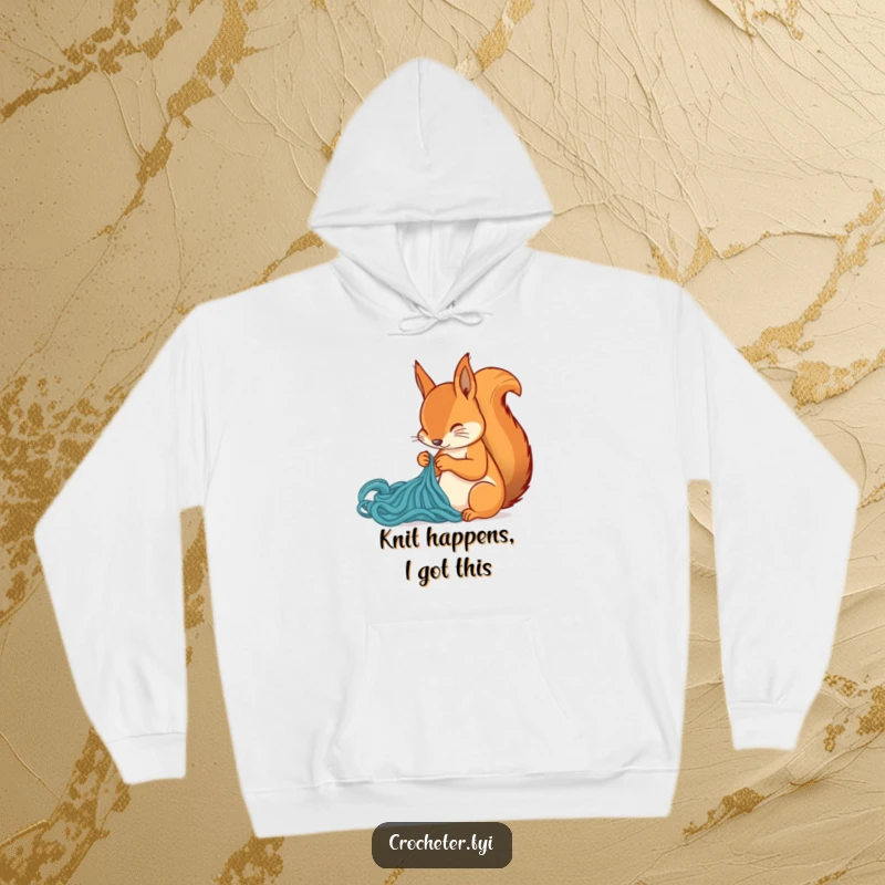 Funny squirrel intently knitting a new creation, featured on a cozy hoodie, a delightful humorous gift for crafters.