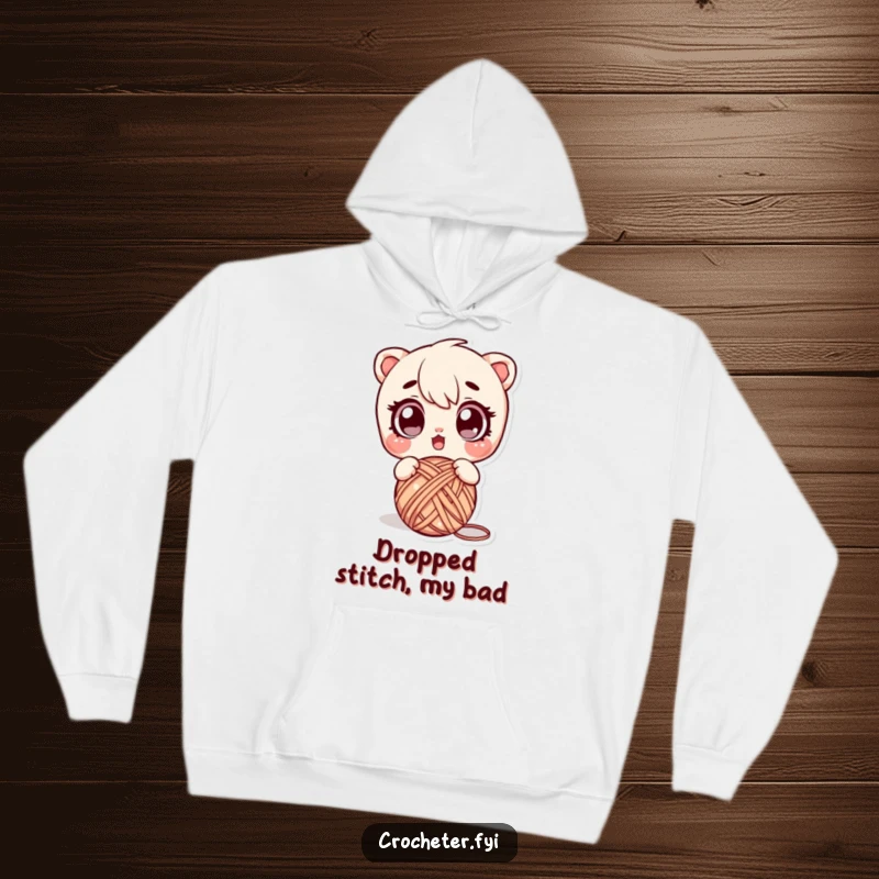 Funny hoodie featuring a character with a surprised expression, dropping a ball of yarn, illustrating a common and funny crafting emergency.