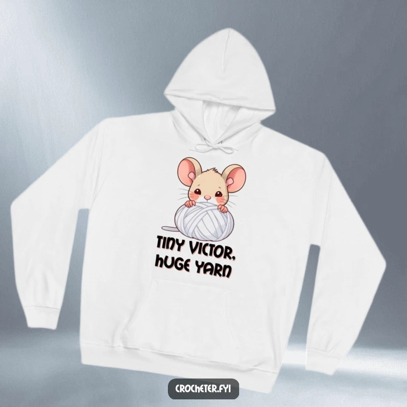 Funny hoodie featuring a victorious mouse peeking from behind a large ball of yarn, radiating crafty accomplishment.