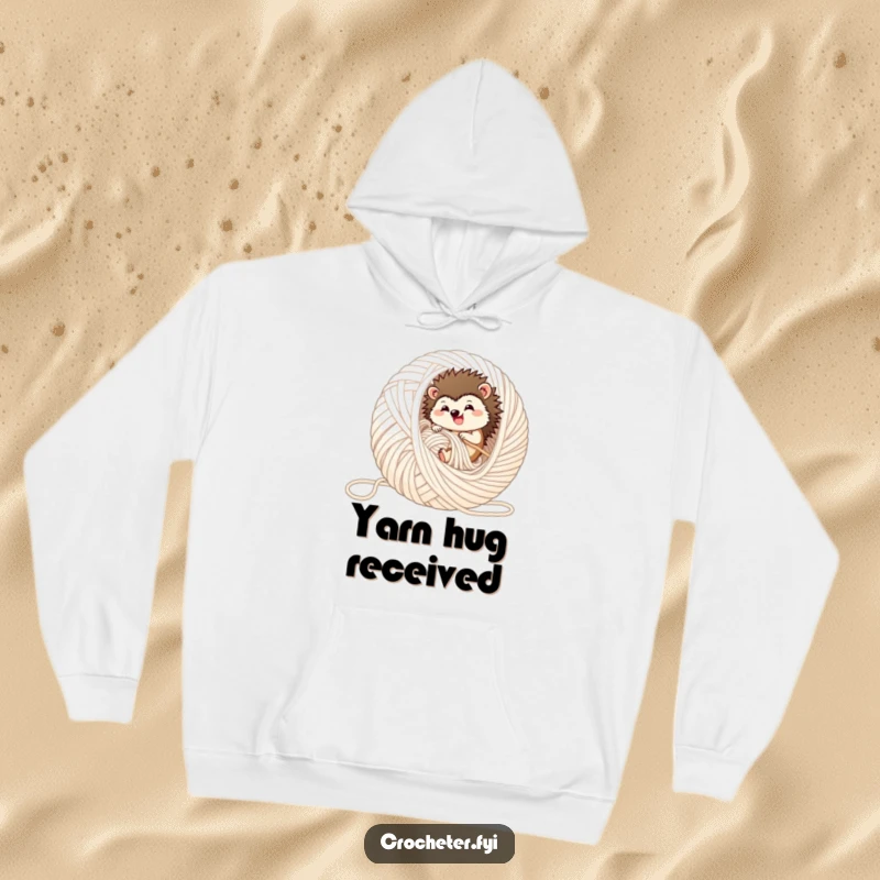 Funny hedgehog hoodie, showing a contented hedgehog rolling within a giant, unraveled yarn ball, ideal for warmth.