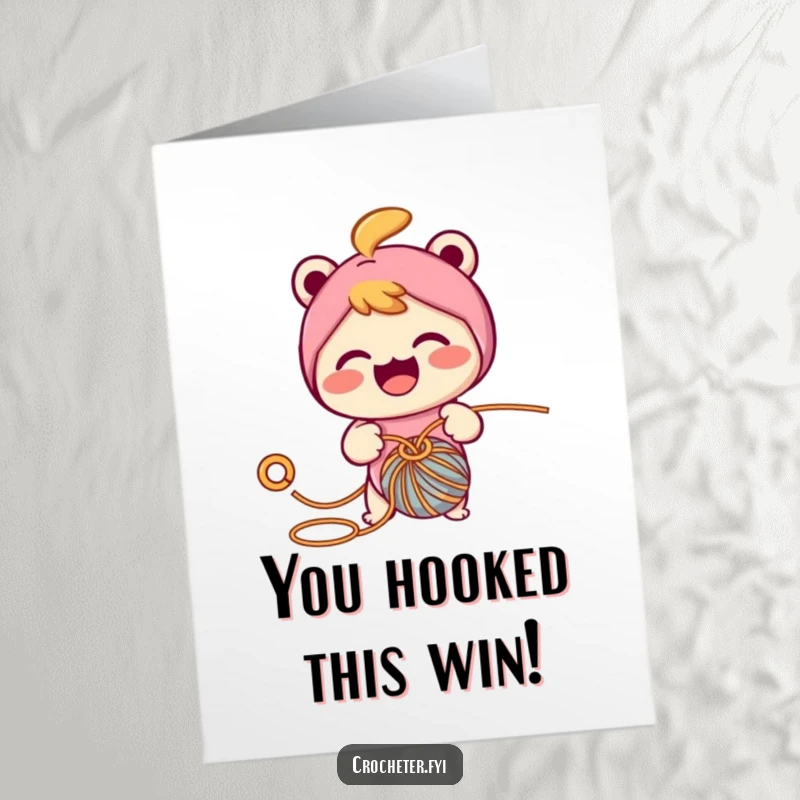 Funny Free Printable Congratulations Card: A cheerful character focused on pulling yarn through a loop with a hook.