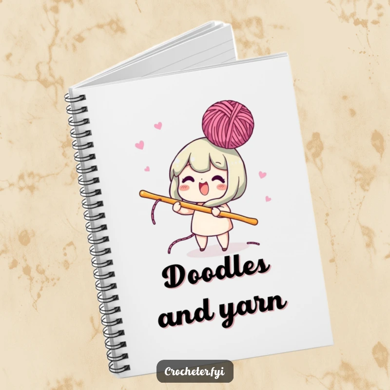 Funny notebook cover showing a lively character using a crochet hook to bob yarn in the air, ideal for creative note-taking.
