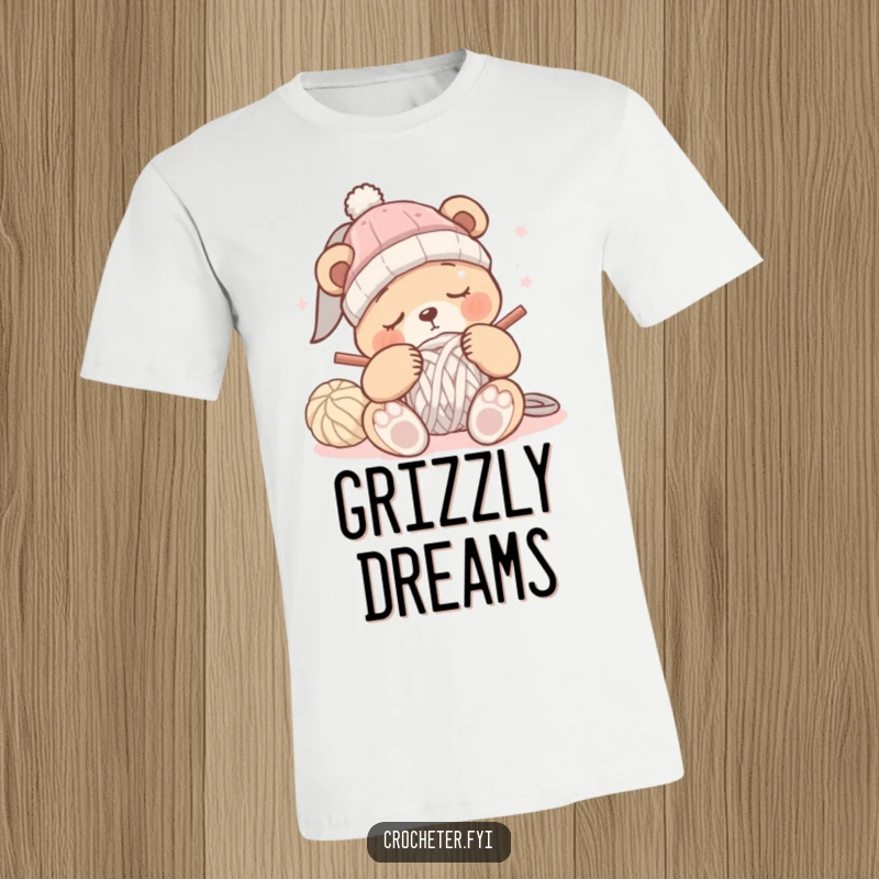 Funny sleepy bear t-shirt depicting a bear trying to crochet a hat but succumbing to sleep, looking very drowsy.