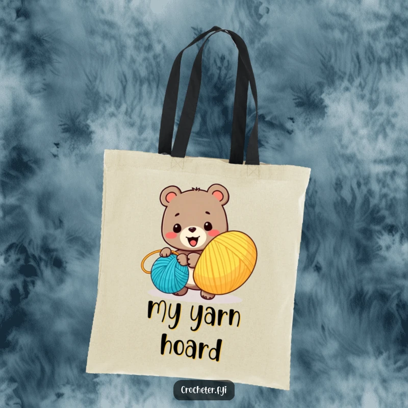 Funny tote bag with a smiling bear character winding a huge ball of colorful yarn, perfect for storing craft supplies.