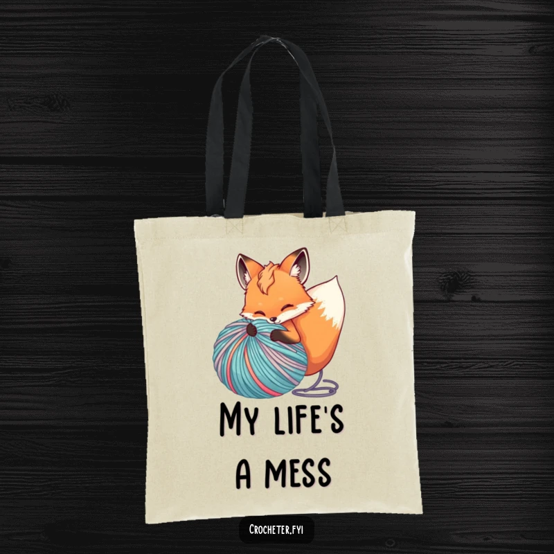 Funny tote bag featuring a playful fox unspooling a huge ball of colorful yarn, ideal for crafters on the go.
